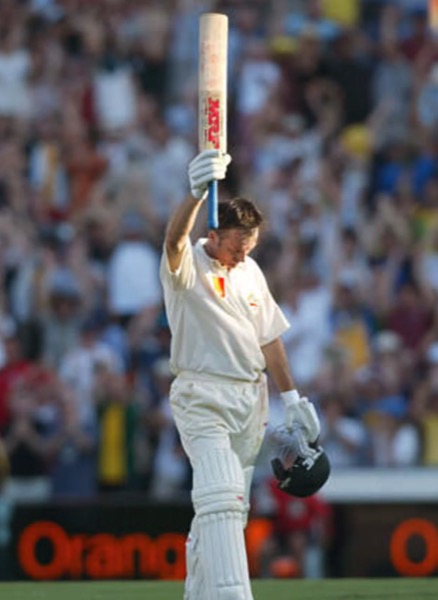 Steve Waugh raises his bat to a packed crowd